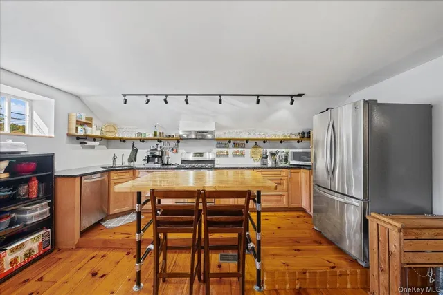 a dining room with a table and chairs