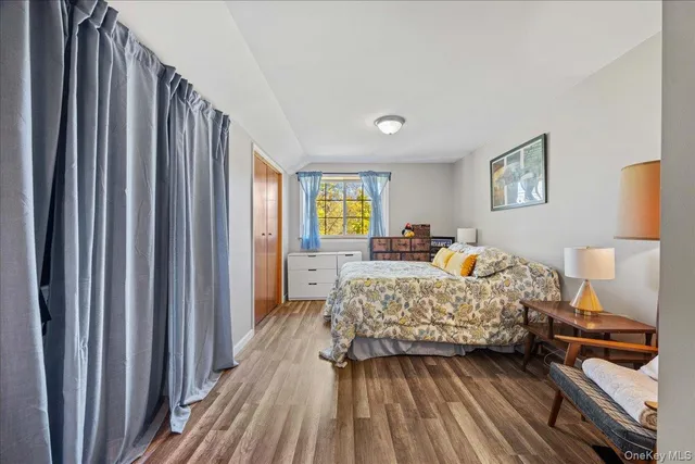 a bed room with a bed and a lamp