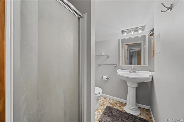 a bathroom with a sink toilet and vanity