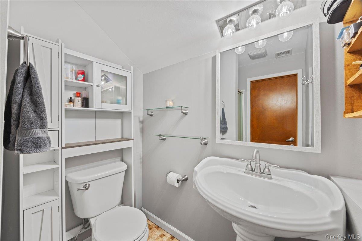 1-3 Amdurer Road Westtown, NY 10998 - Photo 34 of 48 a bathroom with a sink toilet and vanity