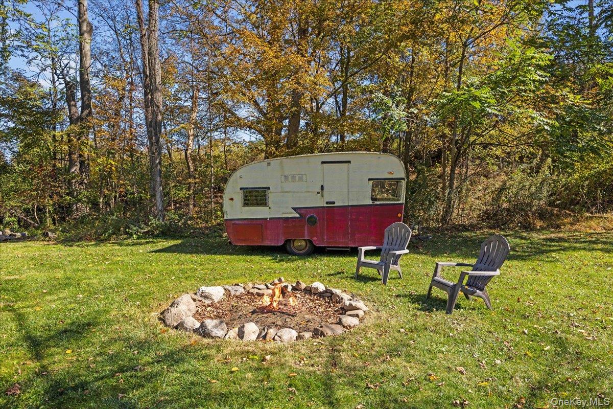1-3 Amdurer Road Westtown, NY 10998 - Photo 39 of 48 a view of backyard with table and chairs and wooden fence