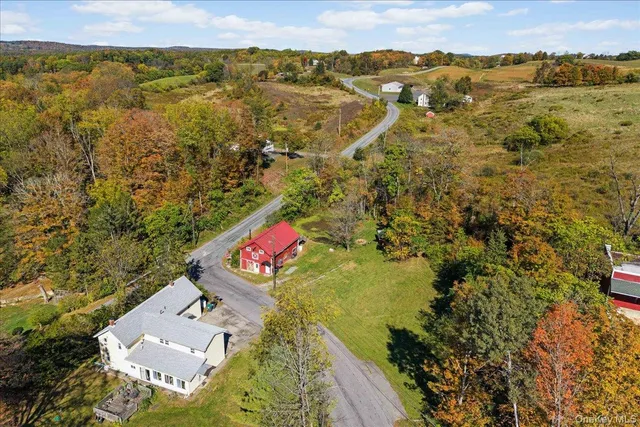 an aerial view of residential houses with outdoor space