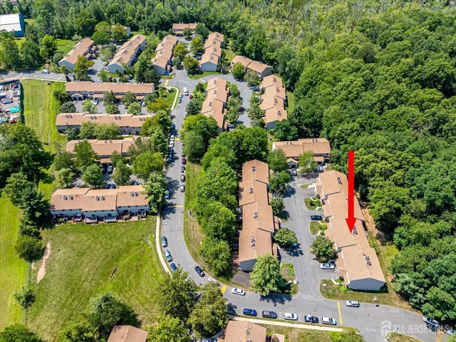 an aerial view of residential house with outdoor space and swimming pool