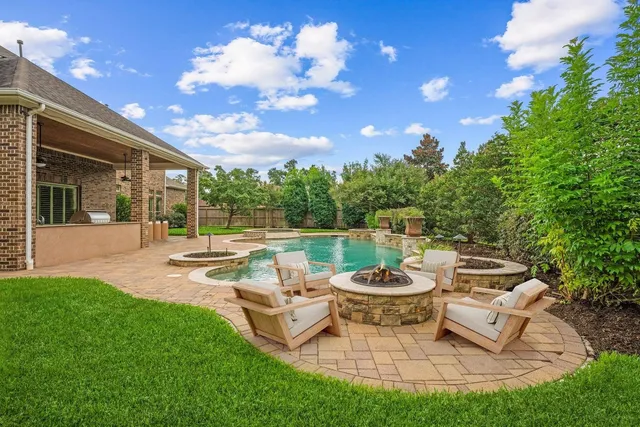 a view of a swimming pool with a patio