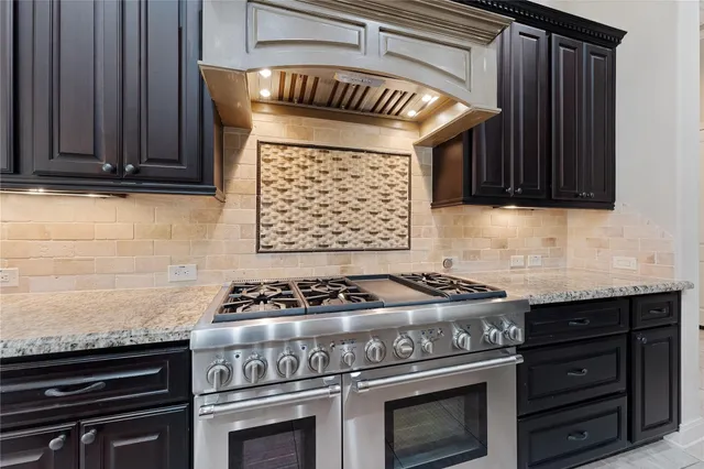 a kitchen with a stove and a microwave