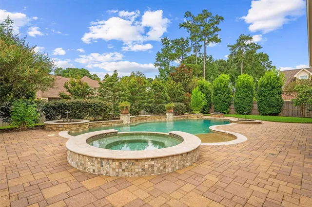 a view of swimming pool with a yard