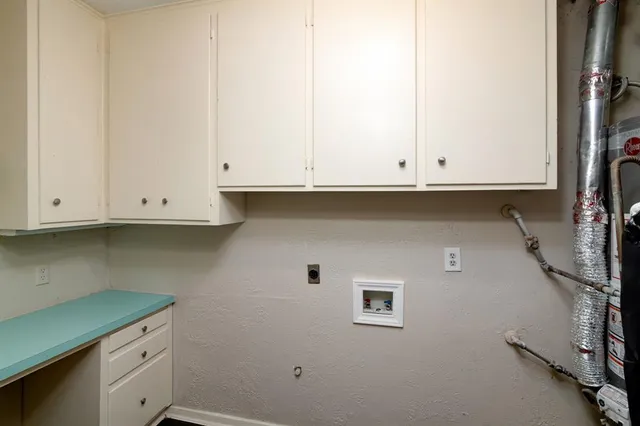 a view of cabinets and wooden floor