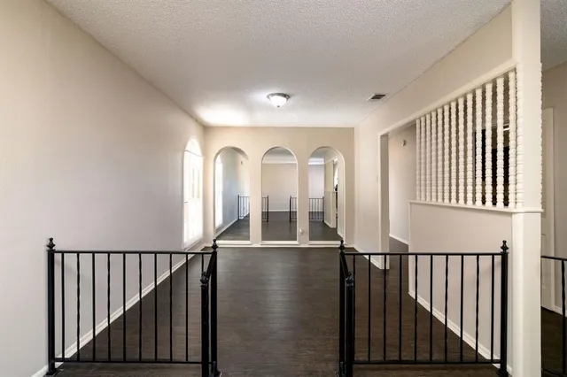 a view of a hallway with windows