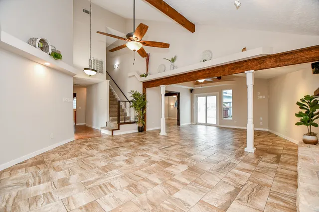 a view of an empty room and window