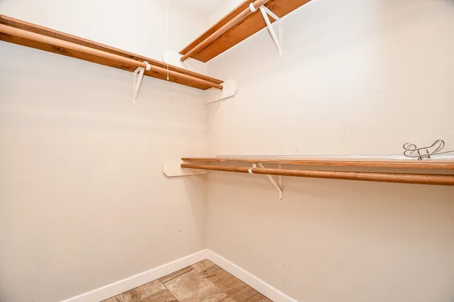 a kitchen with stainless steel appliances granite countertop a refrigerator a stove and a refrigerator