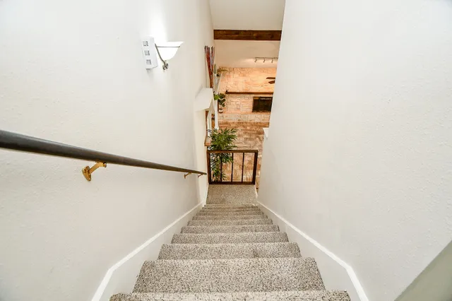a view of kitchen with kitchen island a sink a stove and a oven
