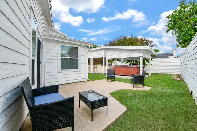 a view of a backyard with a garden