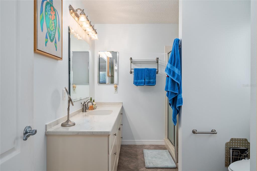 3073 Riverdale Road The Villages, FL 32162 - Photo 17 of 38 a bathroom with a sink and a mirror