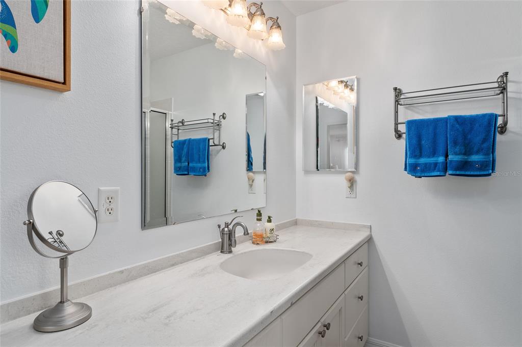 3073 Riverdale Road The Villages, FL 32162 - Photo 18 of 38 a bathroom with a sink and a mirror