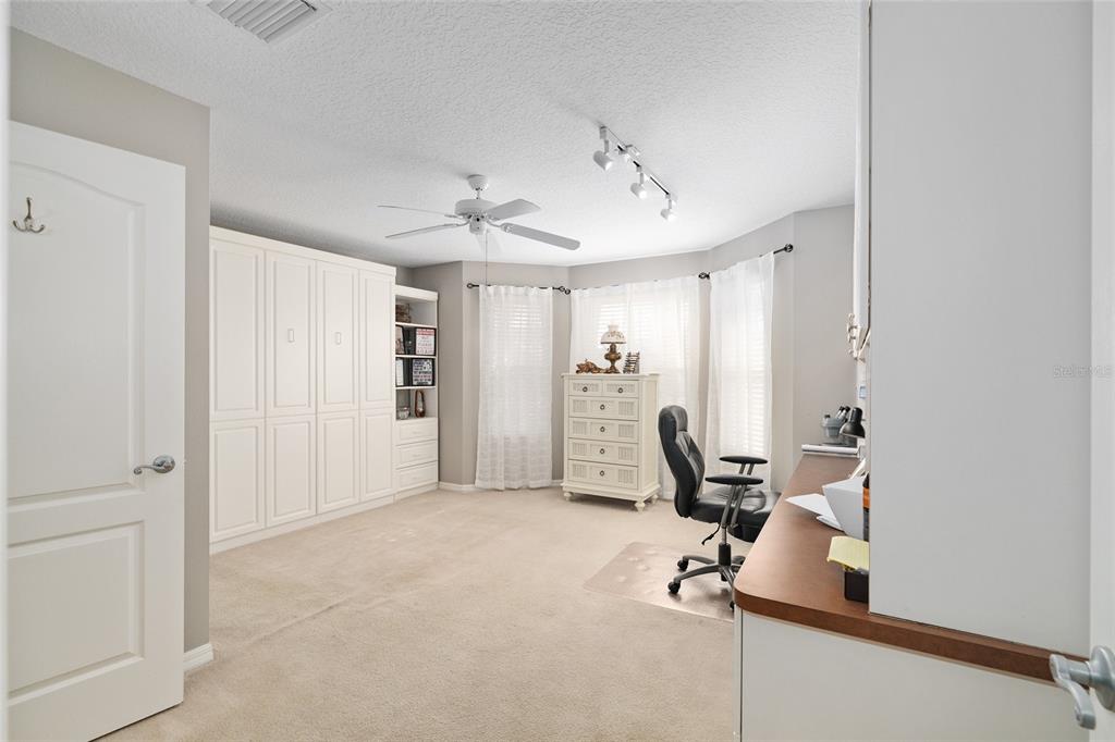 3073 Riverdale Road The Villages, FL 32162 - Photo 19 of 38 a view of a room with gym equipment