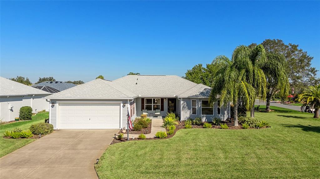 3073 Riverdale Road The Villages, FL 32162 - Photo 2 of 38 a view of a house with backyard porch and garden