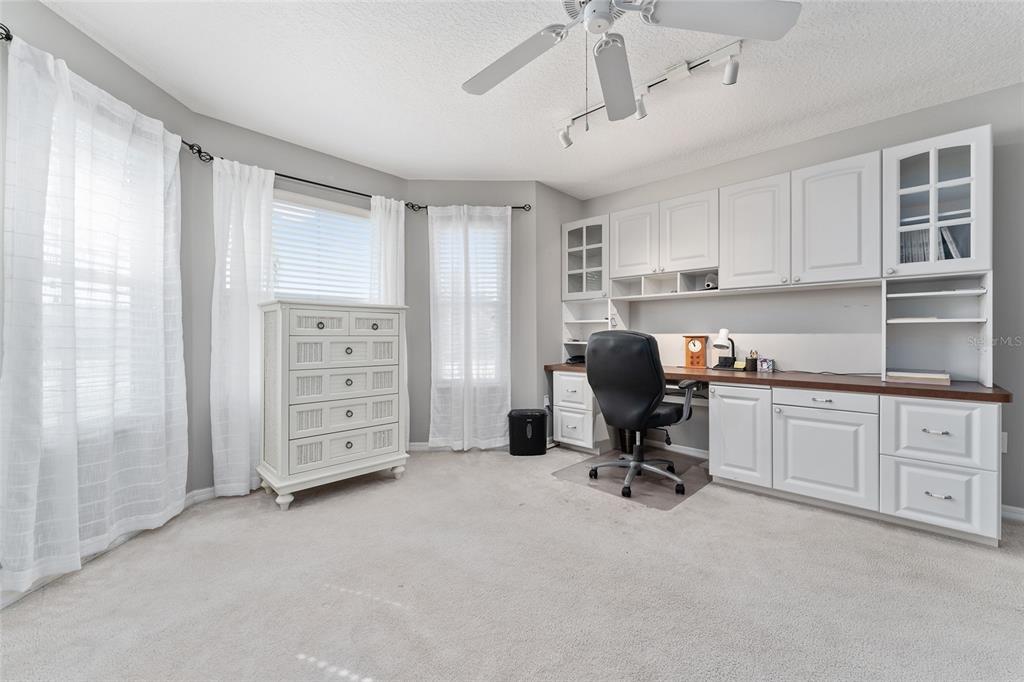 3073 Riverdale Road The Villages, FL 32162 - Photo 21 of 38 a view of a workspace with furniture and a window