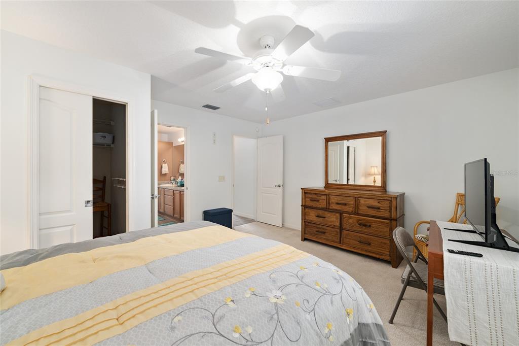 3073 Riverdale Road The Villages, FL 32162 - Photo 26 of 38 a bedroom with a bed and wooden floor