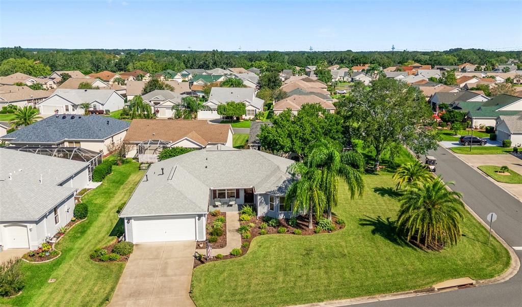 3073 Riverdale Road The Villages, FL 32162 - Photo 32 of 38 an aerial view of a house with a yard and lake view