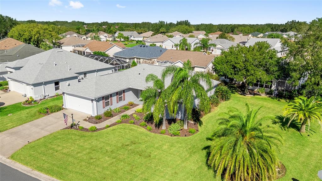 3073 Riverdale Road The Villages, FL 32162 - Photo 34 of 38 an aerial view of residential houses with outdoor space and trees