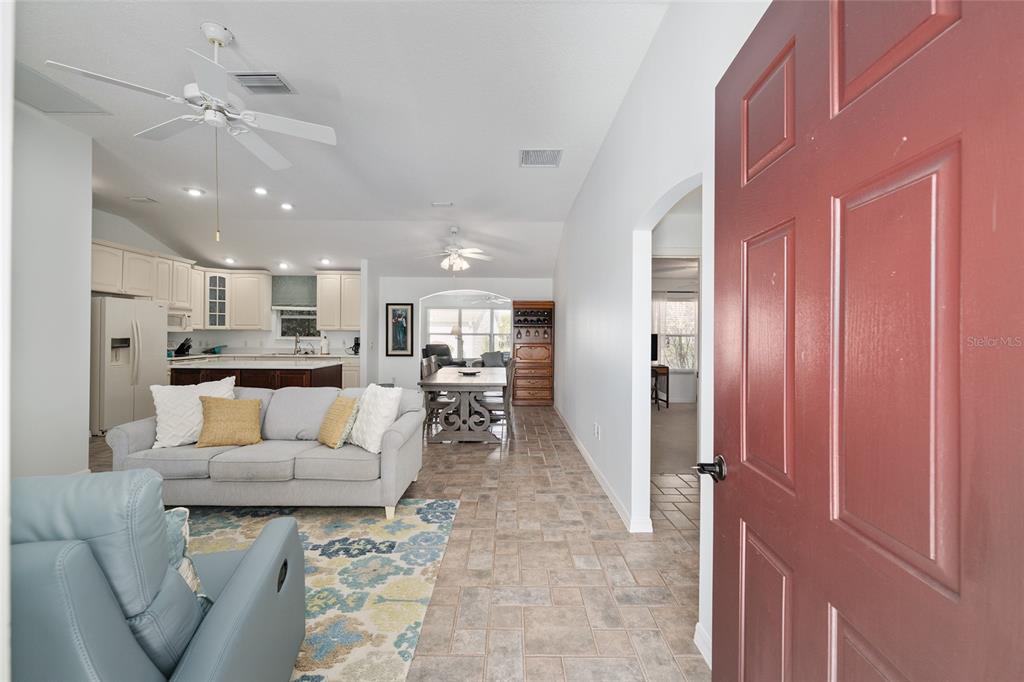 3073 Riverdale Road The Villages, FL 32162 - Photo 4 of 38 a living room with furniture and a view of kitchen