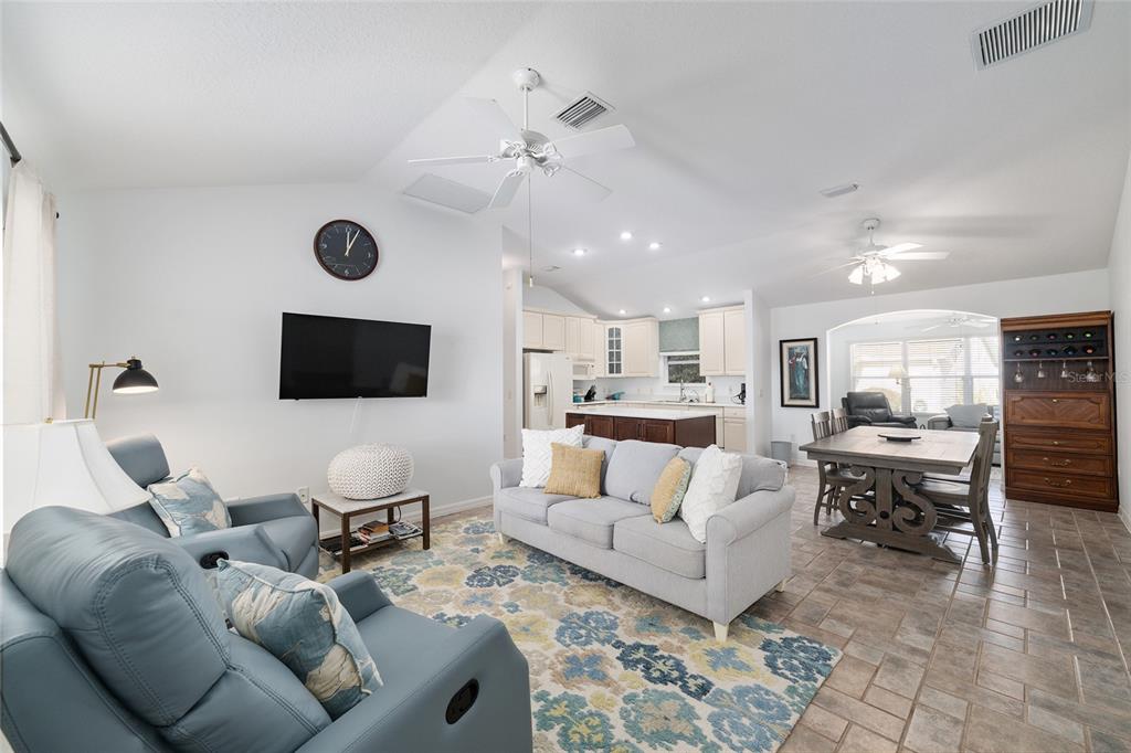 3073 Riverdale Road The Villages, FL 32162 - Photo 5 of 38 a living room with furniture and a flat screen tv