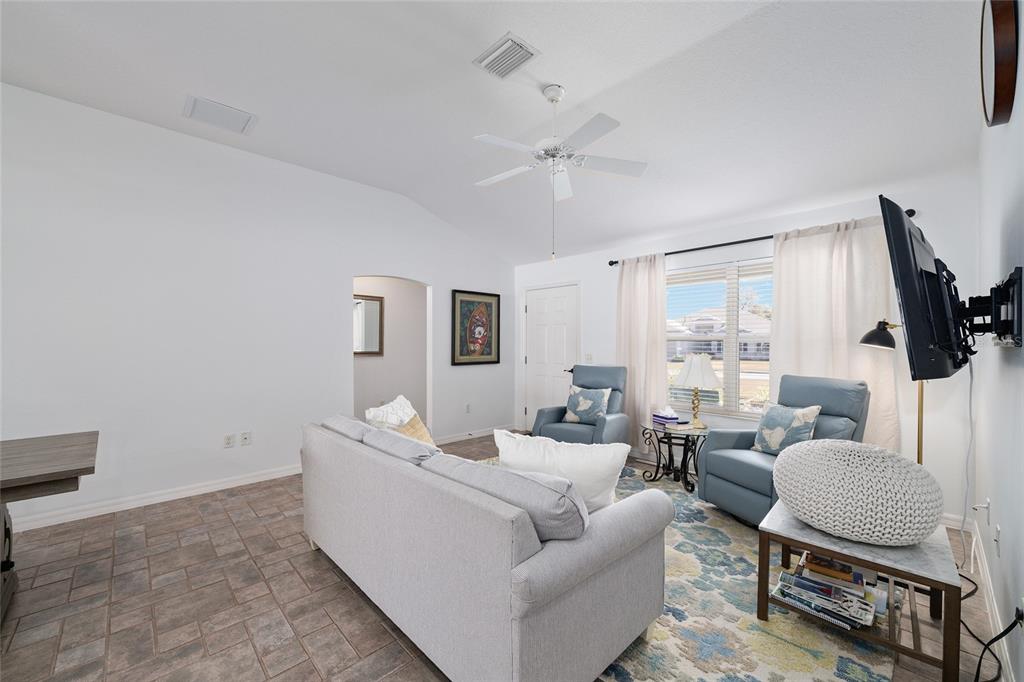 3073 Riverdale Road The Villages, FL 32162 - Photo 6 of 38 a living room with furniture