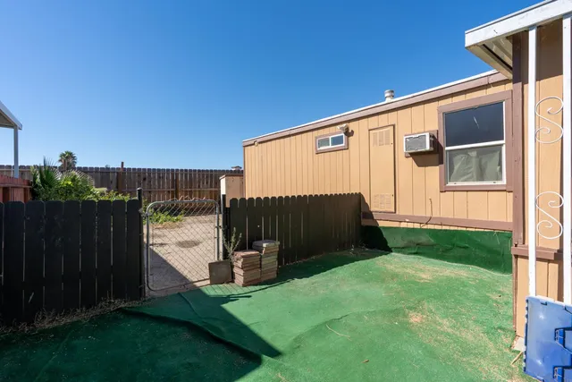 a view of a back yard of the house