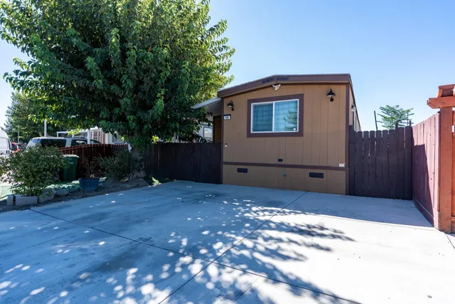 a backyard of a house with lots of green space
