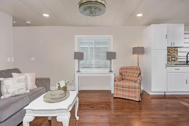 a room with furniture and a wooden floor