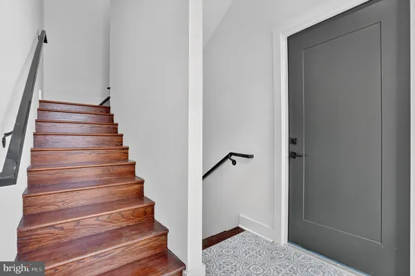 a kitchen with stainless steel appliances granite countertop a sink a stove and wooden floor