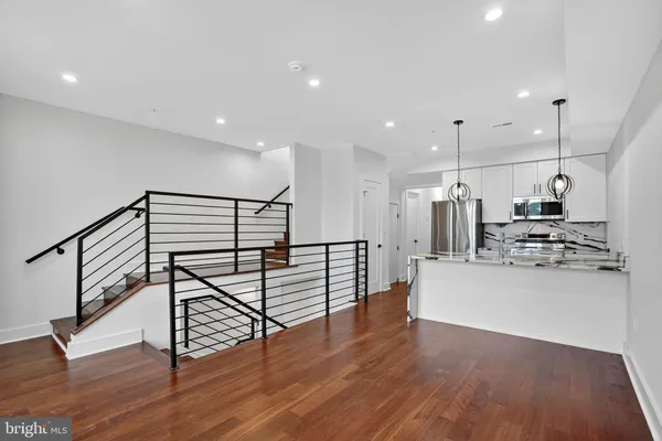 a view of kitchen with furniture and wooden floor