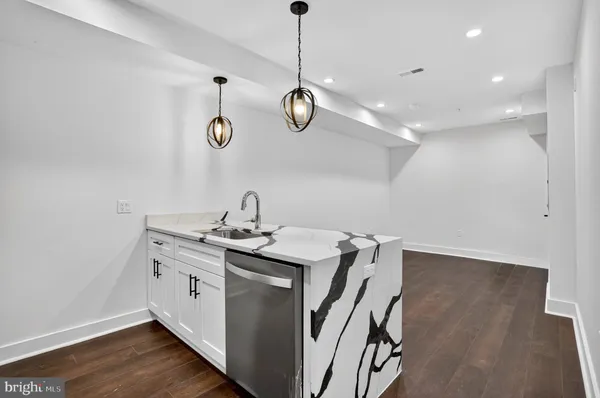 a view of a hallway with washer and dryer