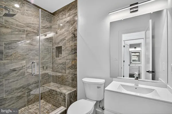 an empty room with wooden floor and a window