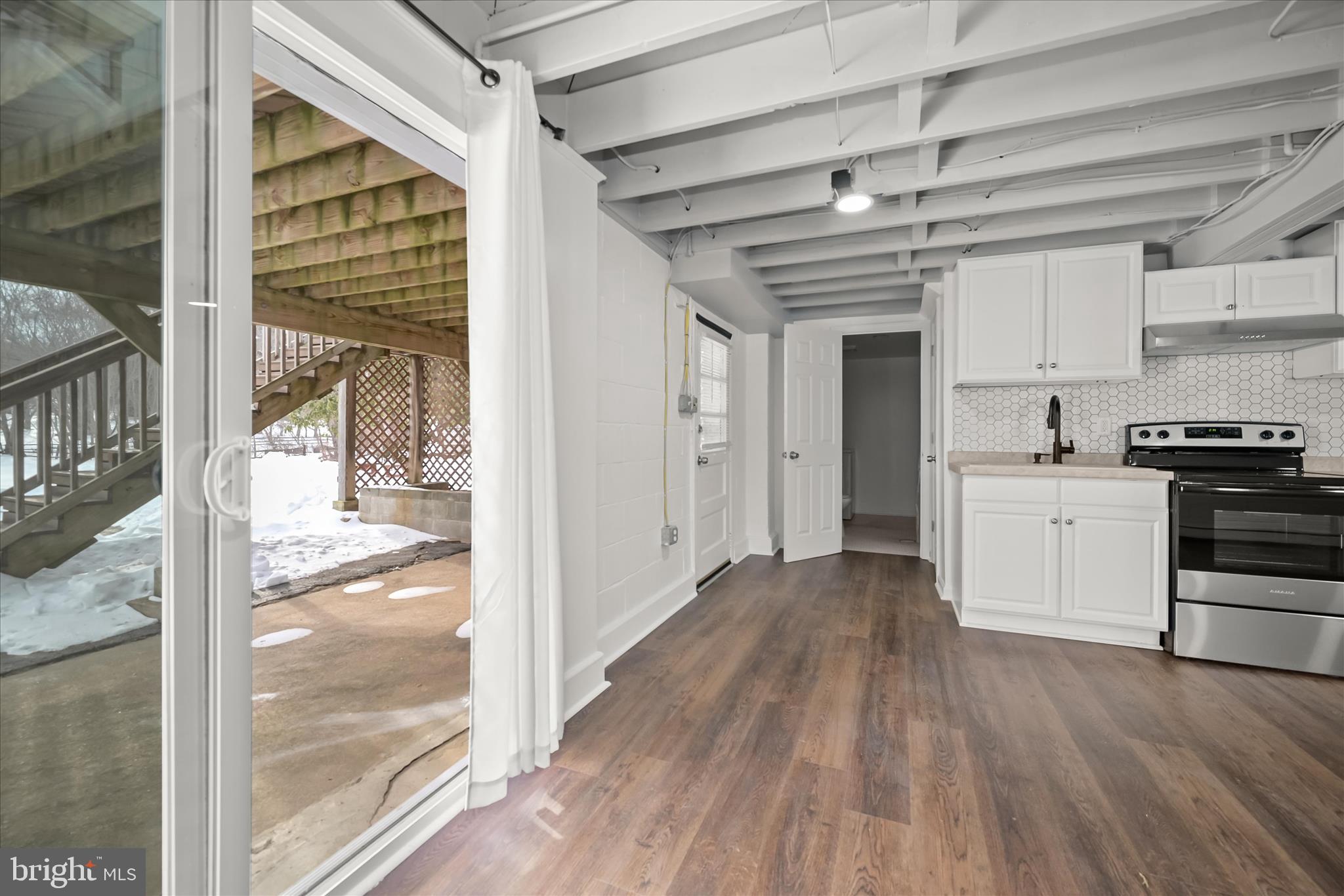 1639 The Strand Westminster, MD 21157 - Photo 14 of 18 a view of a kitchen with wooden floor and a kitchen