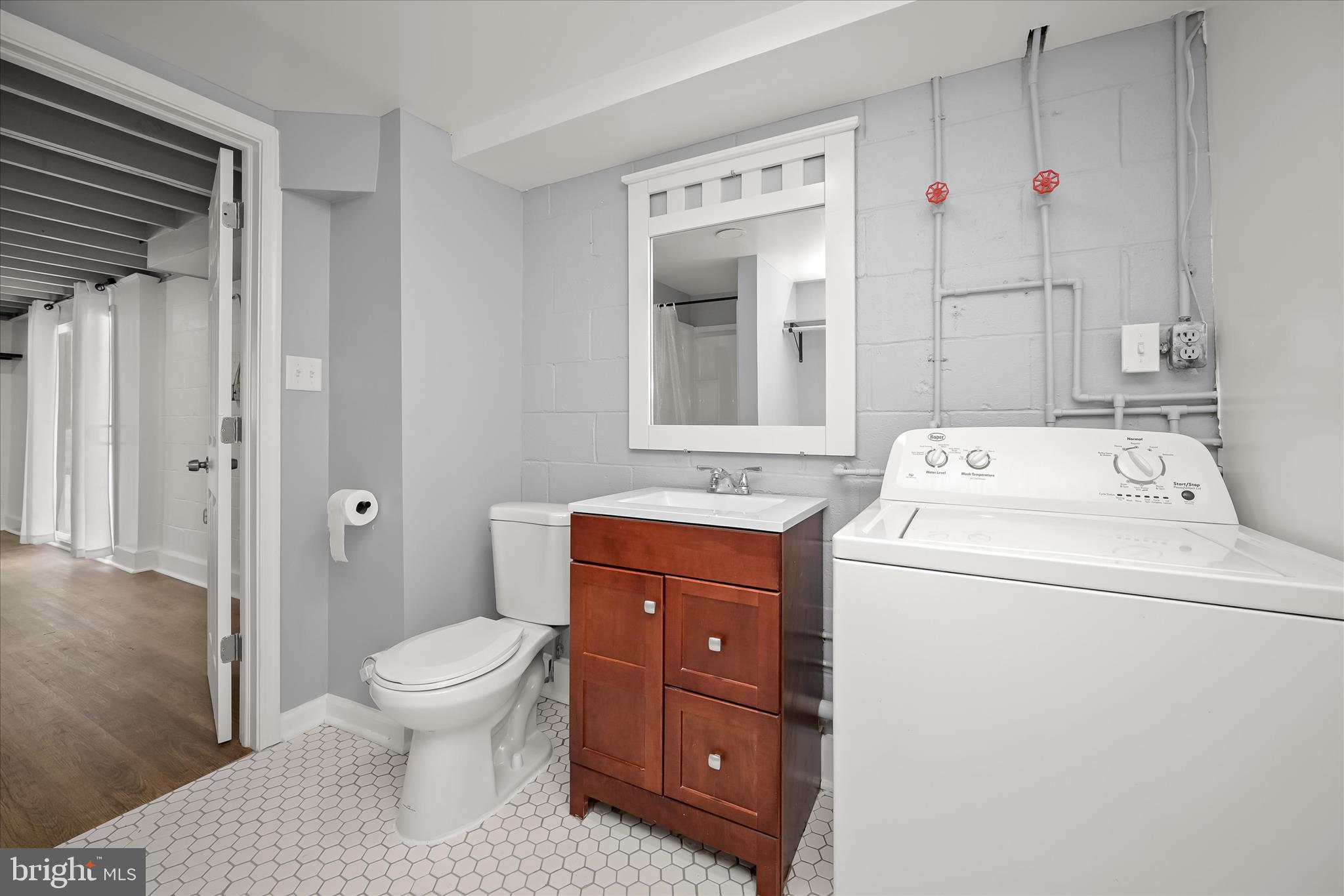 1639 The Strand Westminster, MD 21157 - Photo 17 of 18 a view of bathroom with a toilet sink and mirror
