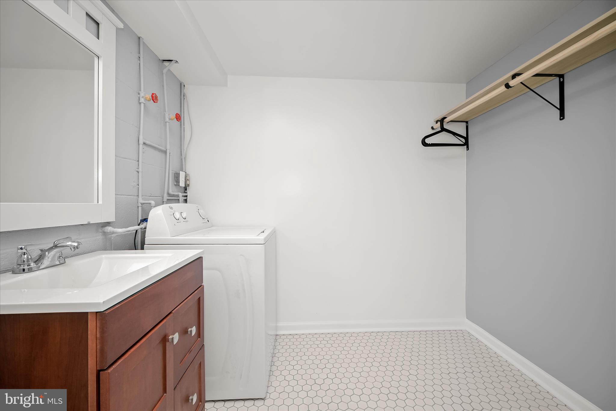 1639 The Strand Westminster, MD 21157 - Photo 18 of 18 a bathroom with a sink vanity and a mirror