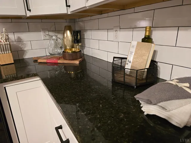 a bedroom with a bed and a mirror