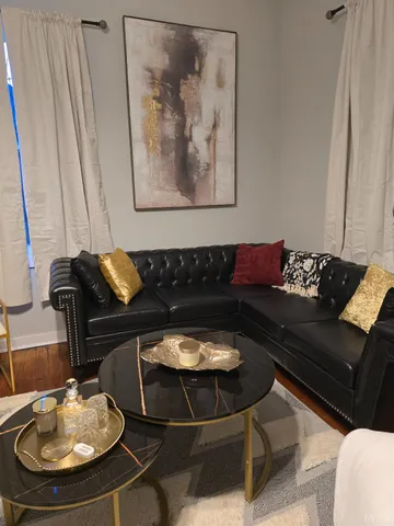 a view of kitchen with furniture and wooden floor