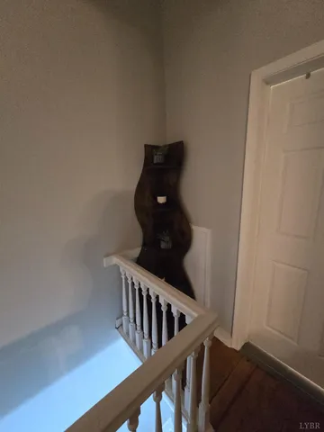 a living room with furniture a couch and a chandelier