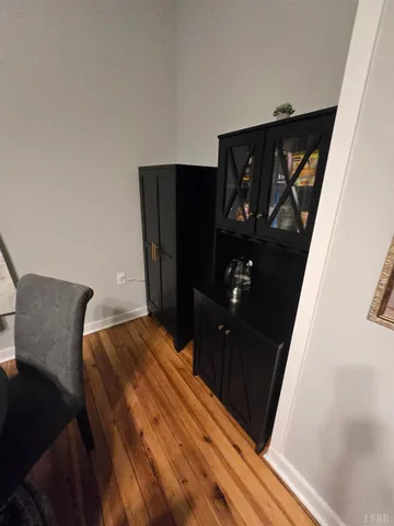 a living room with furniture and a mirror