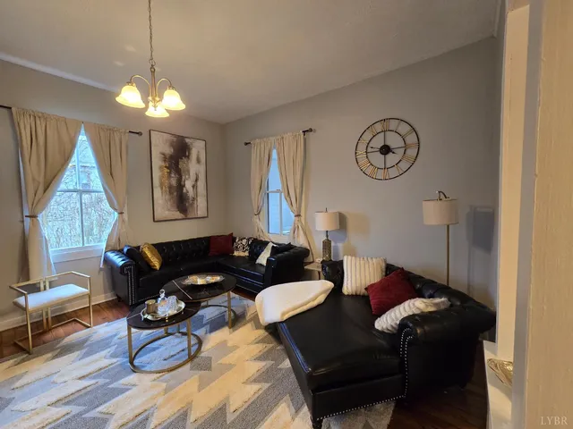 a bedroom with a bed and a potted plant