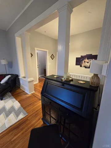 a vase of flowers sitting on a floor