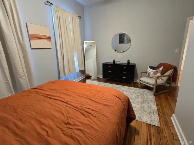 a room with furniture and wooden floor