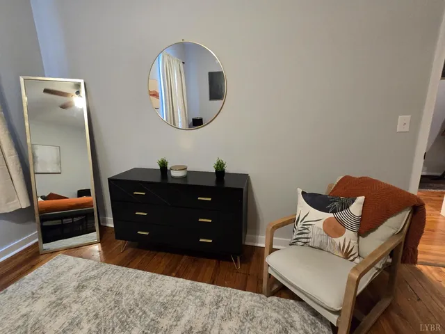 a bedroom with a bed and a view of kitchen