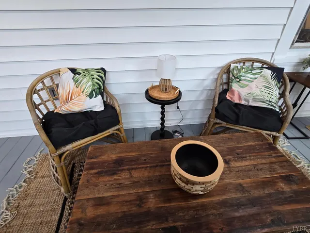 a bedroom with a bed window and couch