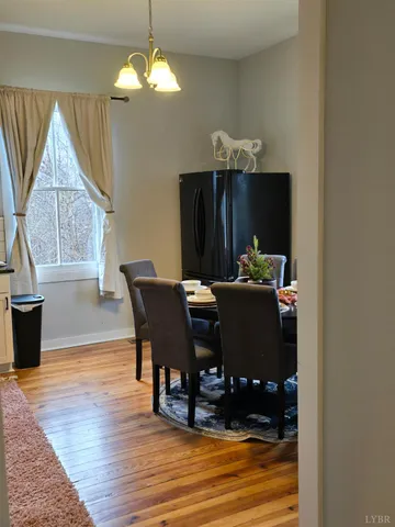 a bedroom with a bed and painting on the wall