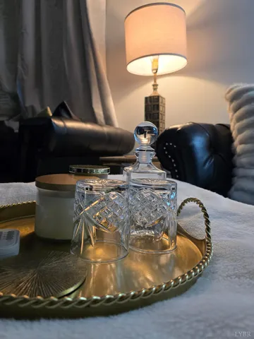 a living room with furniture and a lamp