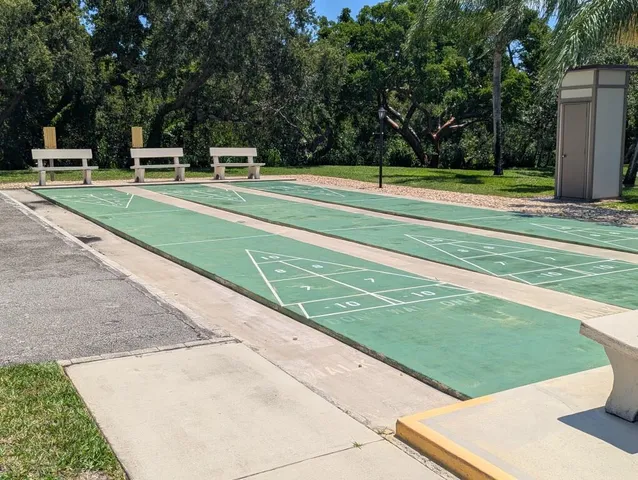 a view of a patio with a table and chairs