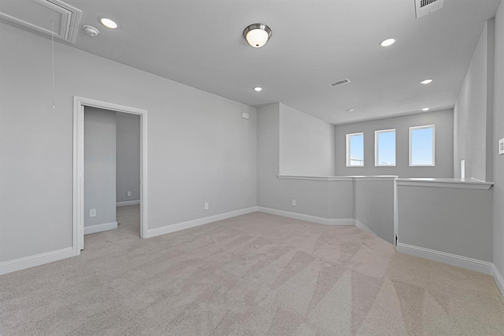 11231 Chimes Street Frisco, TX 75035 - Photo 3 of 5 an empty room with windows and entrance